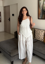 Load image into Gallery viewer, Woman wearing an all white coord set made with organic cotton featuring kantha handwork embroidery.
